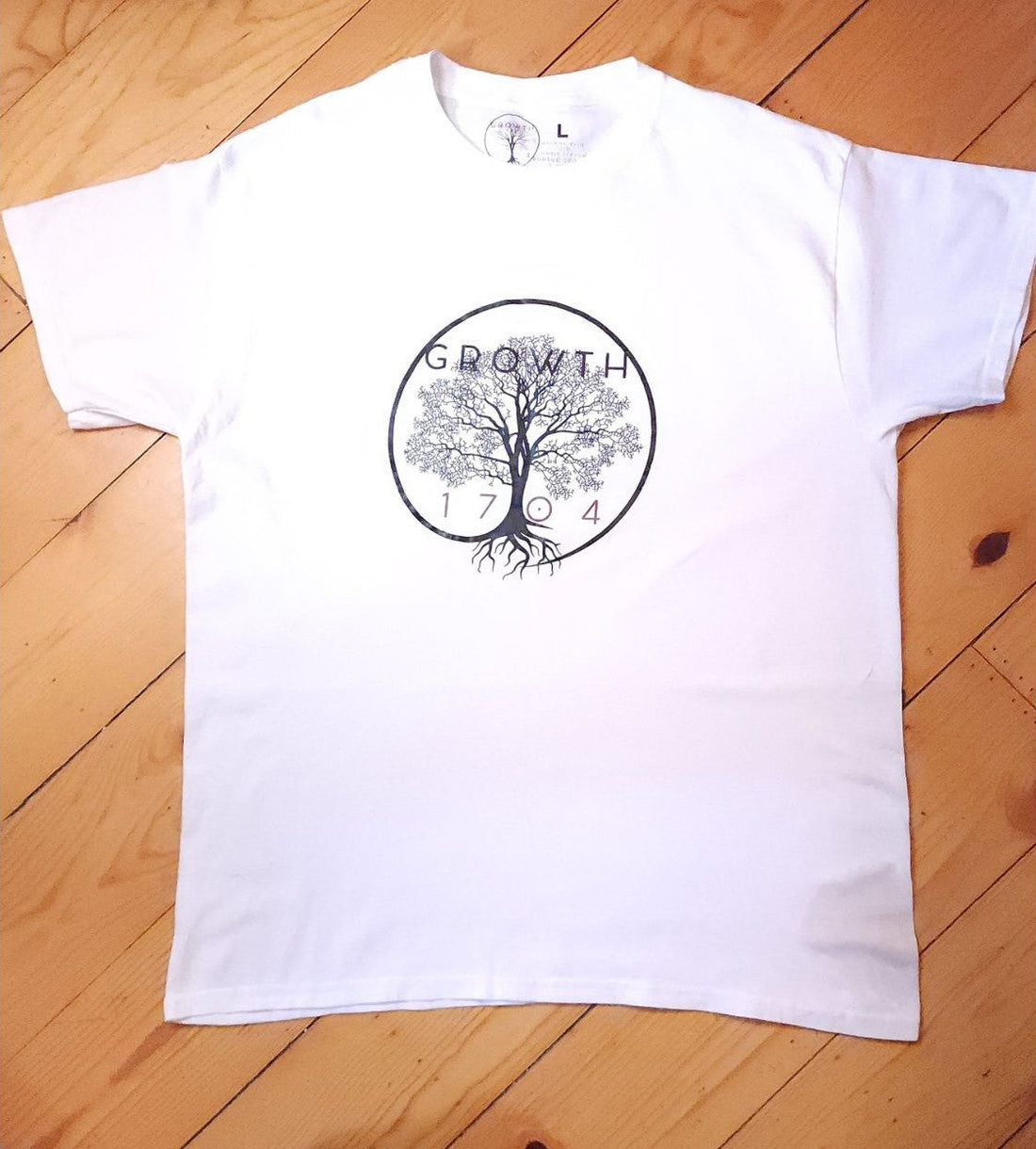Unlocking the Power of the Curved Logo Growth Tee